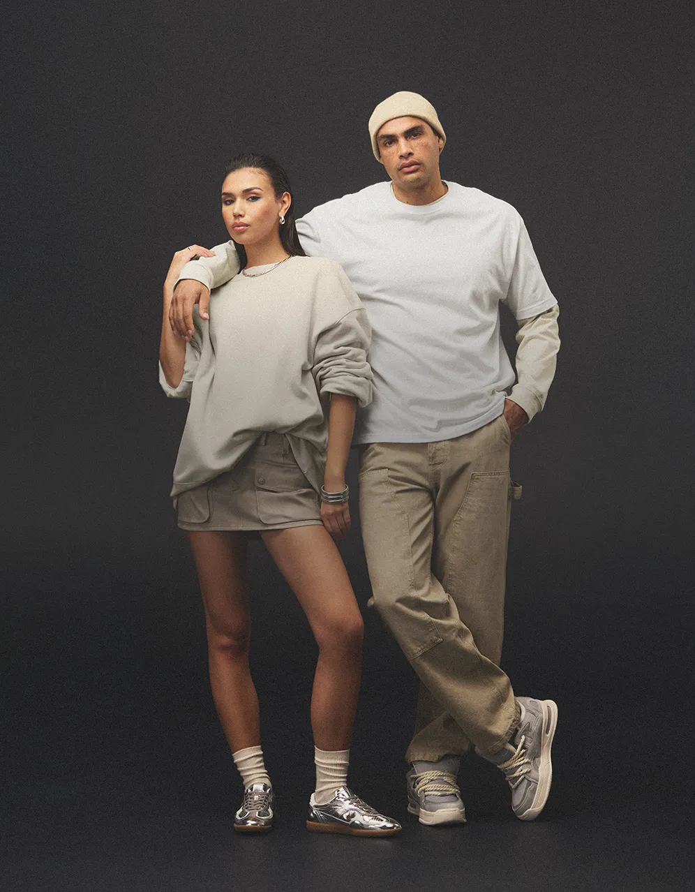 one male and one female model wearing white bellacanvas sweatshirts