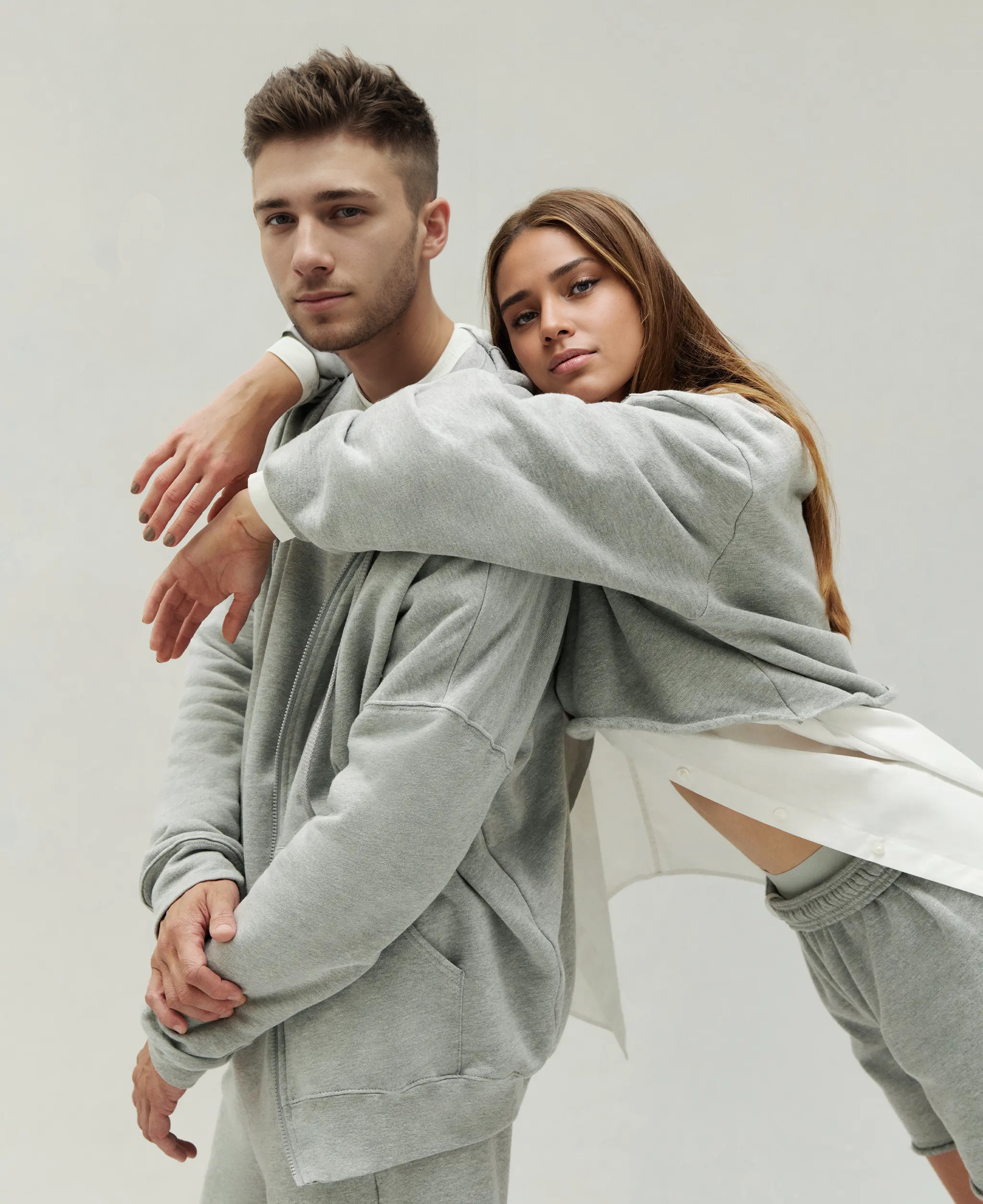 two models wearing athletic heather sweatshirts and sweatpants